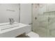 Bathroom with a glass-enclosed shower and modern fixtures, featuring white walls and white sink at 19 Smith St # C, Charleston, SC 29401