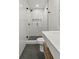 Modern bathroom featuring a glass-enclosed shower, sleek fixtures, and dark flooring at 19 Smith St # C, Charleston, SC 29401
