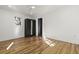 Bedroom featuring hardwood floors, white walls, and storage at 19 Smith St # C, Charleston, SC 29401