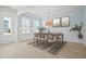 Light-filled dining room featuring modern decor, neutral tones, and stylish light fixture at 190 Steepbrook Dr, Summerville, SC 29486