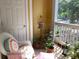 Cozy balcony with seating and plants, perfect for relaxing outdoors with a charming, comfortable design at 1928 Chatelain Way, Mount Pleasant, SC 29464