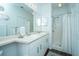 Spacious bathroom featuring double sinks, a shower, and ample storage at 1928 Chatelain Way, Mount Pleasant, SC 29464