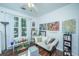 Bright living room featuring a futon, lots of decor and natural light from the windows at 1928 Chatelain Way, Mount Pleasant, SC 29464