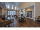 Bright lounge area features a fireplace, french doors and ample seating at 1928 Chatelain Way, Mount Pleasant, SC 29464