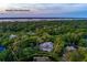 Expansive estate on a 1.23 acre double corner lot surrounded by lush greenery and waterfront at 200 Belted Kingfisher Rd, Kiawah Island, SC 29455