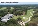 Breathtaking aerial view showcasing the golf course and beautiful architecture of clubhouse at 200 Belted Kingfisher Rd, Kiawah Island, SC 29455