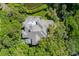 A stunning aerial view of a home surrounded by lush greenery, showcasing privacy and a beautiful natural setting at 200 Belted Kingfisher Rd, Kiawah Island, SC 29455
