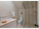 Bathroom featuring a stone vanity and frameless glass enclosed shower at 200 Belted Kingfisher Rd, Kiawah Island, SC 29455