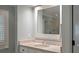 Bathroom with a marble counter vanity and a large mirror reflecting the glass shower at 200 Belted Kingfisher Rd, Kiawah Island, SC 29455