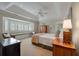 Bedroom with a built in daybed below a large window, and neutral carpeting at 200 Belted Kingfisher Rd, Kiawah Island, SC 29455
