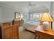 Comfortable bedroom featuring a bay window with bench seating and decorative, neutral color scheme at 200 Belted Kingfisher Rd, Kiawah Island, SC 29455