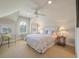 Bright bedroom with light carpeting featuring a window seat and ceiling fan at 200 Belted Kingfisher Rd, Kiawah Island, SC 29455