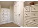 Well-organized closet with built-in drawers and ample storage space with sleek hardware at 200 Belted Kingfisher Rd, Kiawah Island, SC 29455