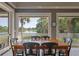 Bright and airy dining area with serene waterfront views and ample natural light at 200 Belted Kingfisher Rd, Kiawah Island, SC 29455