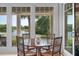 Charming dining area with seating for four and scenic views of the surrounding water at 200 Belted Kingfisher Rd, Kiawah Island, SC 29455