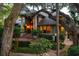 Elegant home with manicured landscaping and mature trees, showcasing curb appeal and inviting entrance at 200 Belted Kingfisher Rd, Kiawah Island, SC 29455