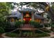 Stately home with meticulously maintained front yard and grand entrance with brick stairs and large porch at 200 Belted Kingfisher Rd, Kiawah Island, SC 29455