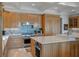 Gourmet kitchen featuring custom cabinetry, stone countertops, and stainless steel Wolf appliances at 200 Belted Kingfisher Rd, Kiawah Island, SC 29455