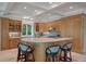 A kitchen with wooden cabinets and trim along with an island at 200 Belted Kingfisher Rd, Kiawah Island, SC 29455