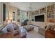 Comfortable living room with built-in bookshelves, natural light, and cozy seating at 200 Belted Kingfisher Rd, Kiawah Island, SC 29455