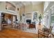 Elegant living room with fireplace, built-in bookshelves, and views from the balcony at 200 Belted Kingfisher Rd, Kiawah Island, SC 29455