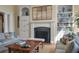 A living room shows fireplace, built-in bookshelves, and plush seating at 200 Belted Kingfisher Rd, Kiawah Island, SC 29455