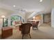 Cozy living room features arched windows, built-in shelving, and comfortable seating at 200 Belted Kingfisher Rd, Kiawah Island, SC 29455