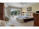 Spacious main bedroom with light-filled windows, outdoor access, and neutral decor at 200 Belted Kingfisher Rd, Kiawah Island, SC 29455