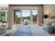 Main bedroom with views of the lake and access to the outdoor patio at 200 Belted Kingfisher Rd, Kiawah Island, SC 29455