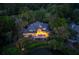 Picturesque backyard with spacious deck overlooking the pond and lush greenery at twilight at 200 Belted Kingfisher Rd, Kiawah Island, SC 29455
