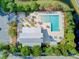 Aerial view of the community pool area, showing the pool, pavilion, lounge area, and parking surrounded by lush greenery at 2008 Welsh Pony Dr, Mount Pleasant, SC 29429