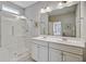 A bright bathroom with a glass-enclosed shower, dual sinks, and modern fixtures for a luxurious experience at 2008 Welsh Pony Dr, Mount Pleasant, SC 29429