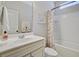 Clean bathroom with a white vanity, seashell-themed shower curtain, and a framed print at 2008 Welsh Pony Dr, Mount Pleasant, SC 29429