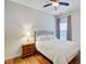 Cozy bedroom features a ceiling fan, wood floors, a comfortable bed, and a wooden nightstand at 2008 Welsh Pony Dr, Mount Pleasant, SC 29429