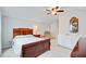 Inviting bedroom featuring a dark wood bed frame, a recliner, and a ceiling fan at 2008 Welsh Pony Dr, Mount Pleasant, SC 29429