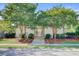 Clubhouse with manicured landscaping, sidewalks, and attractive entry gate at 2008 Welsh Pony Dr, Mount Pleasant, SC 29429