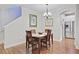 Traditional dining room adjacent to kitchen has hardwood floors, and chandelier lighting at 2008 Welsh Pony Dr, Mount Pleasant, SC 29429