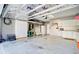 Well-organized garage with ample storage cabinets and a clean epoxy floor at 2008 Welsh Pony Dr, Mount Pleasant, SC 29429