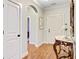 Hallway featuring hard surface floors and a view into a bedroom through an arched doorway at 2008 Welsh Pony Dr, Mount Pleasant, SC 29429