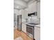 An updated kitchen featuring stainless steel appliances, wood flooring, a modern oven, and elegant cabinetry at 2008 Welsh Pony Dr, Mount Pleasant, SC 29429