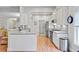 Bright kitchen with white cabinets, stainless steel appliances, and a breakfast bar at 2008 Welsh Pony Dr, Mount Pleasant, SC 29429