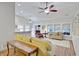 Open-concept living room featuring high ceilings, ceiling fan, hard surface flooring, and lots of natural light at 2008 Welsh Pony Dr, Mount Pleasant, SC 29429