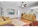 Comfortable living room with built-in shelving and a view of the dining area, offering a cozy gathering space at 2008 Welsh Pony Dr, Mount Pleasant, SC 29429