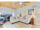 A well-lit living room featuring a comfortable sofa, ample windows, and stylish decor for a welcoming atmosphere at 2008 Welsh Pony Dr, Mount Pleasant, SC 29429