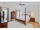 The main bedroom features a vaulted ceiling, ceiling fan, wooden furniture, and windows with stylish curtains at 2008 Welsh Pony Dr, Mount Pleasant, SC 29429