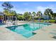 Community pool with sun loungers, tables, and umbrellas, offering a refreshing outdoor gathering space for residents at 2008 Welsh Pony Dr, Mount Pleasant, SC 29429