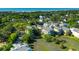 Stunning aerial view showcasing neighborhood homes, lush trees and serene marshland at 204 Michigan Ave B3 # 16, Folly Beach, SC 29439