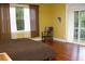 Bedroom with hardwood floors and access to the outdoor balcony through sliding glass doors at 204 Michigan Ave B3 # 16, Folly Beach, SC 29439