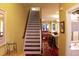 Warm entryway featuring hardwood floors and stairs leading to the main living area at 204 Michigan Ave B3 # 16, Folly Beach, SC 29439