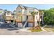 Inviting home featuring a charming exterior with palm trees, a garage, and manicured landscaping at 204 Michigan Ave B3 # 16, Folly Beach, SC 29439